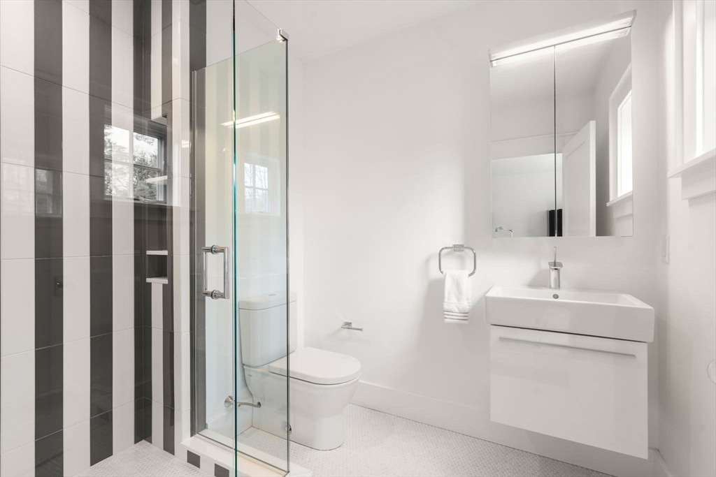 72 Love Lane Weston, MA 02493 - Photo 29 of 41 a bathroom with a toilet sink and shower