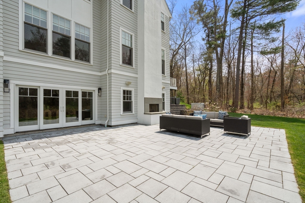 72 Love Lane Weston, MA 02493 - Photo 36 of 41 a view of a terrace with chairs and a yard