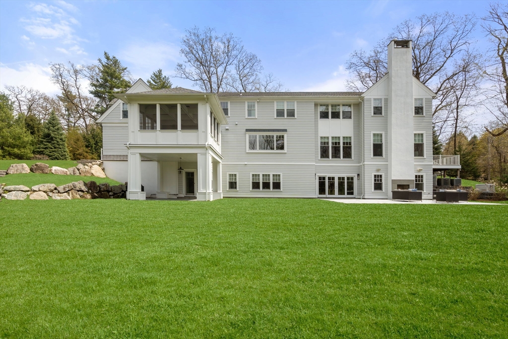 72 Love Lane Weston, MA 02493 - Photo 40 of 41 a view of building with yard and trees in the background
