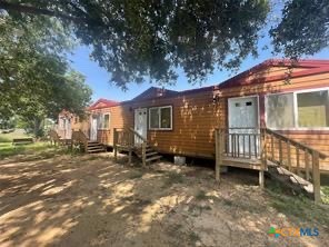 1104 Rorem Avenue Palacios, TX 77465 - Photo 2 of 17 a view of a house with a yard