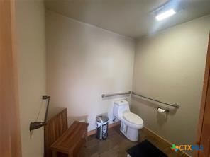 1104 Rorem Avenue Palacios, TX 77465 - Photo 6 of 17 a white toilet sitting next to a bathroom sink