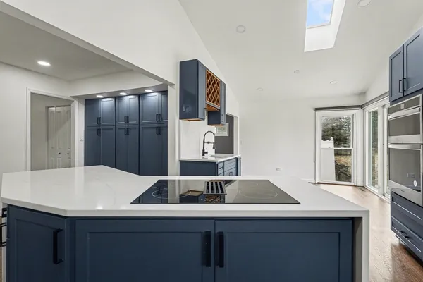 a kitchen with a sink and cabinets