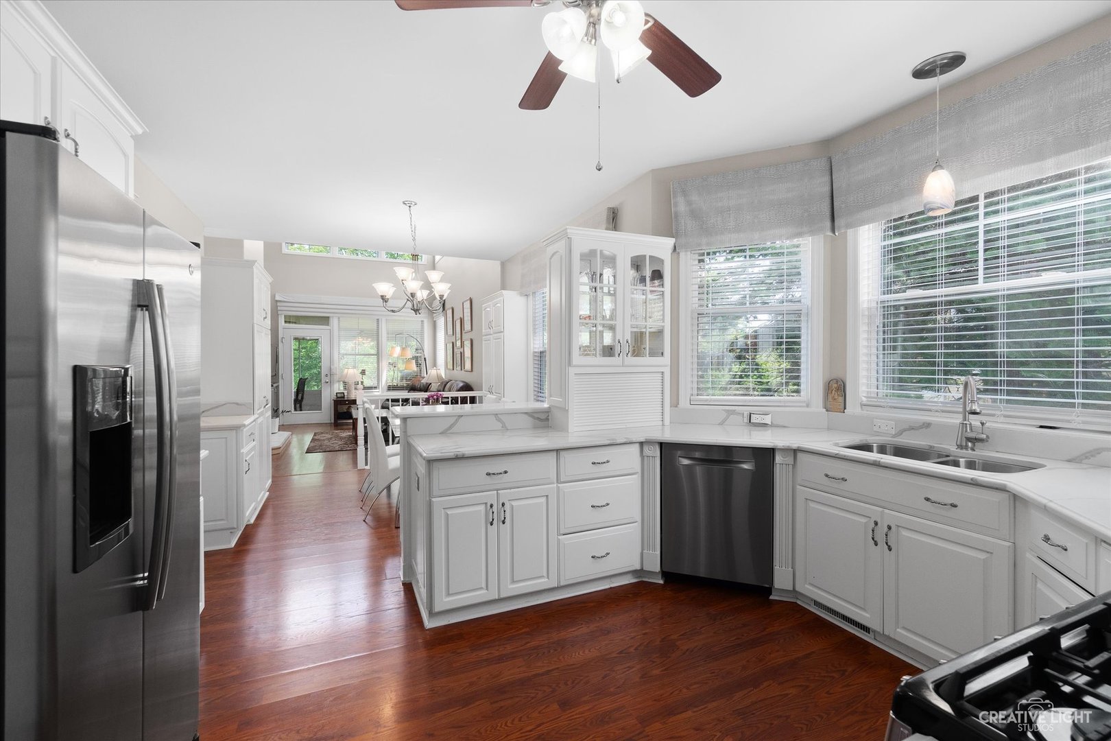 708 Viewpointe Drive St. Charles, IL 60174 - Photo 11 of 38 a large kitchen with kitchen island a sink stainless steel appliances and cabinets