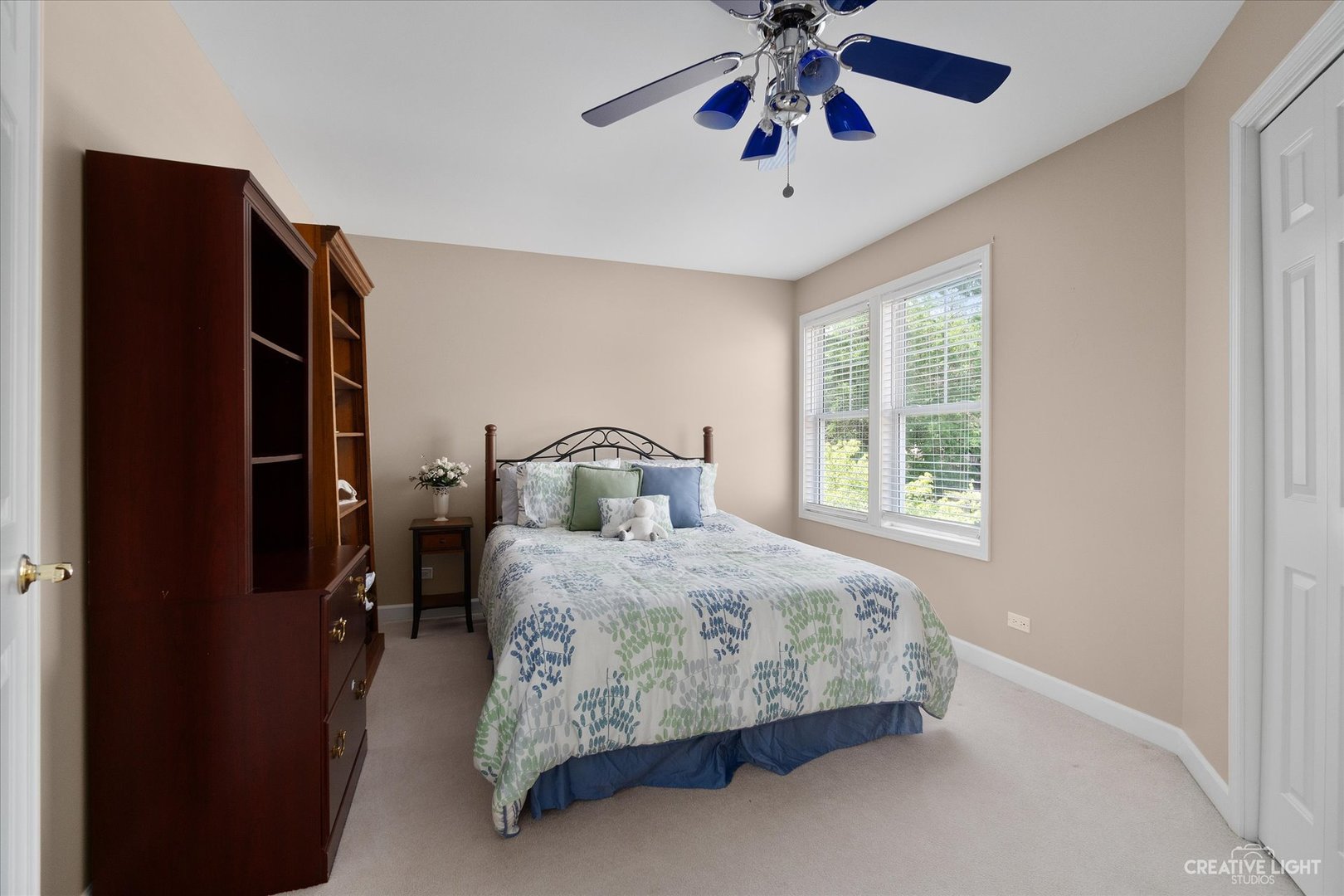 708 Viewpointe Drive St. Charles, IL 60174 - Photo 21 of 38 a bedroom with a bed and a chandelier