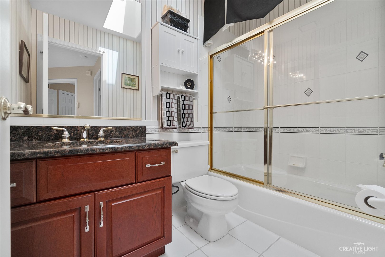 708 Viewpointe Drive St. Charles, IL 60174 - Photo 31 of 38 a bathroom with a sink a toilet and shower
