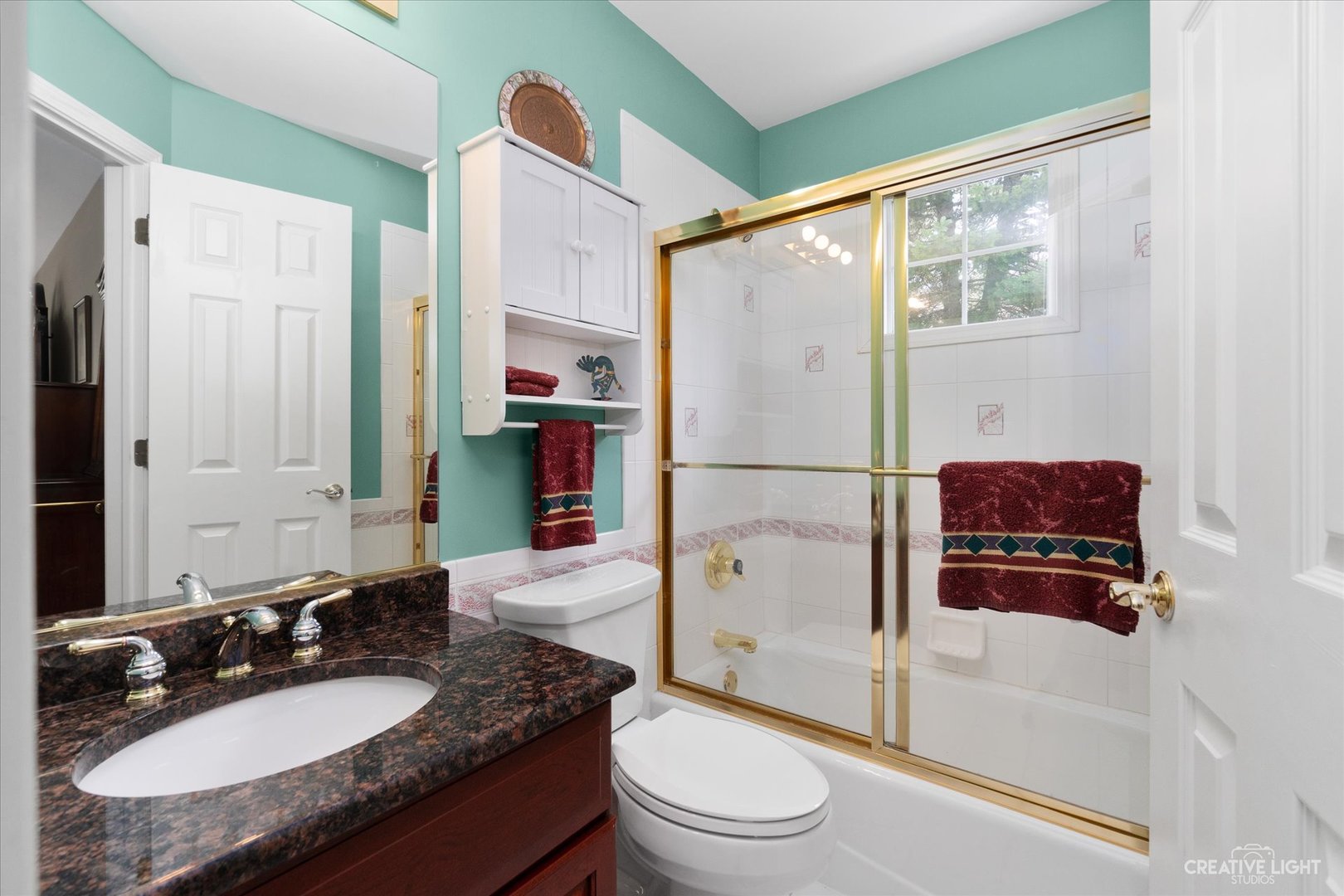 708 Viewpointe Drive St. Charles, IL 60174 - Photo 33 of 38 a bathroom with a granite countertop sink toilet mirror and shower