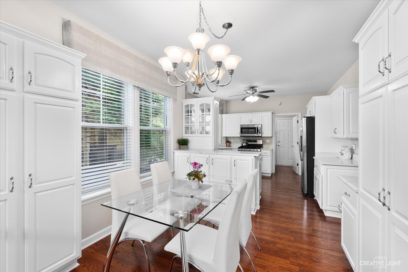 708 Viewpointe Drive St. Charles, IL 60174 - Photo 9 of 38 a view of a dining room with furniture and wooden floor
