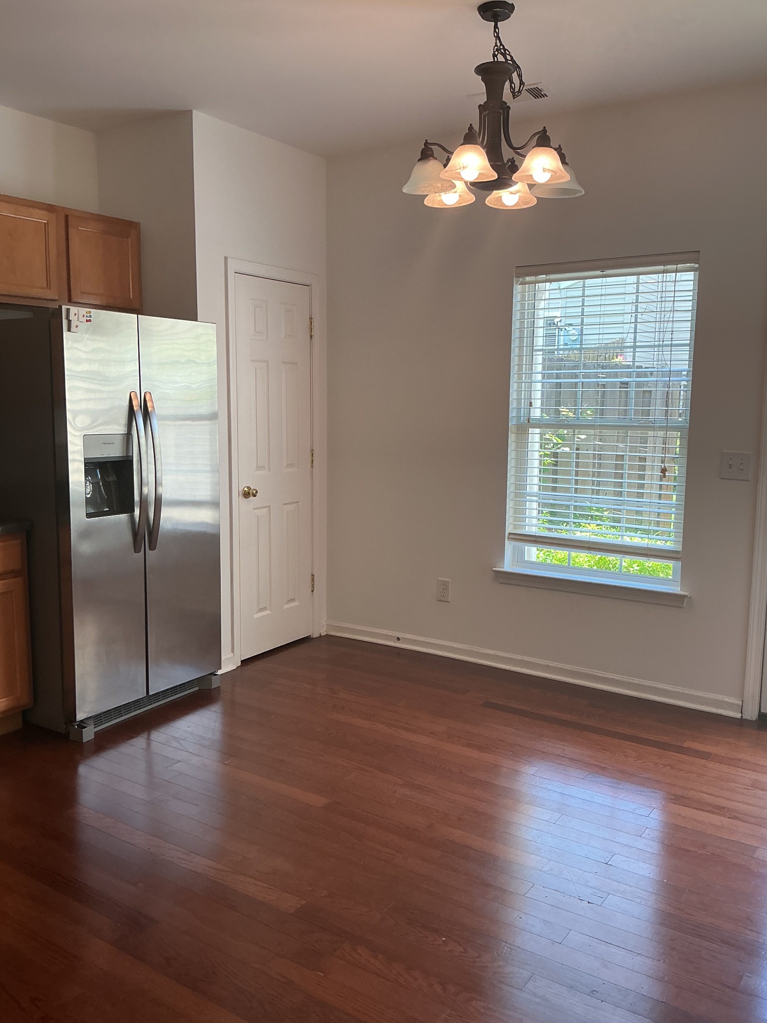 1101 Downs Boulevard, Unit J102 Franklin, TN 37064 - Photo 3 of 21 a view of a kitchen with a dishwasher cabinets and wooden floor