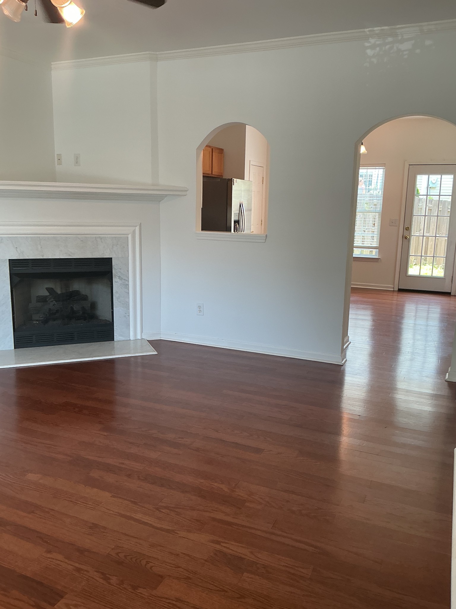 1101 Downs Boulevard, Unit J102 Franklin, TN 37064 - Photo 6 of 21 a view of a livingroom with wooden floor and a fireplace