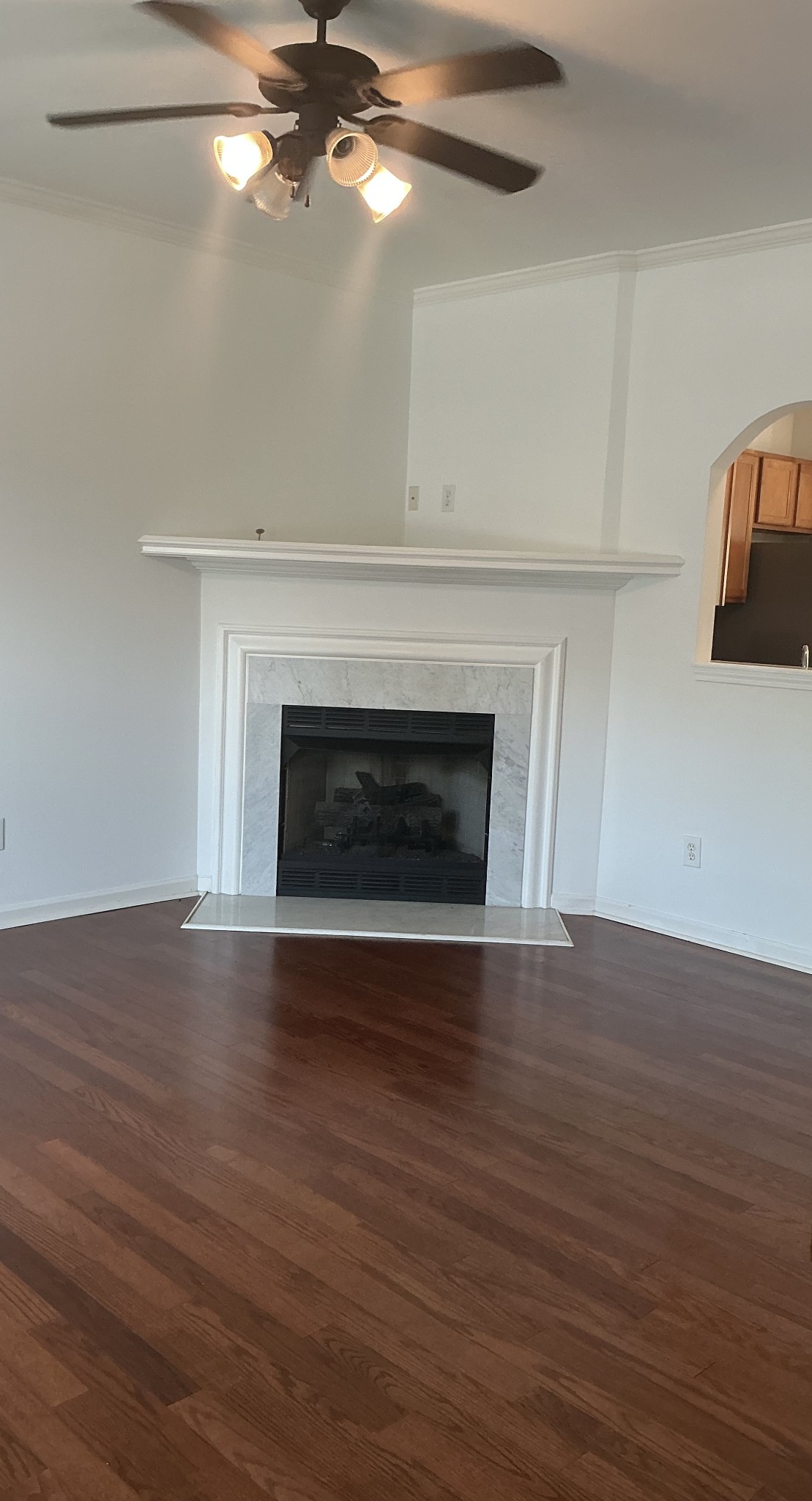 1101 Downs Boulevard, Unit J102 Franklin, TN 37064 - Photo 7 of 21 a view of an empty room with wooden floor fireplace and a window
