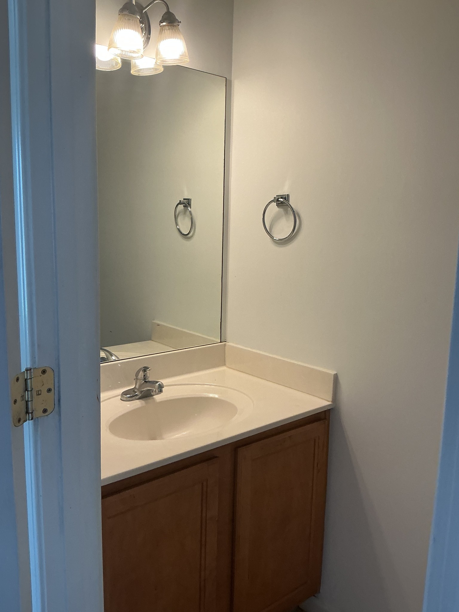 1101 Downs Boulevard, Unit J102 Franklin, TN 37064 - Photo 9 of 21 a bathroom with a sink vanity and a mirror