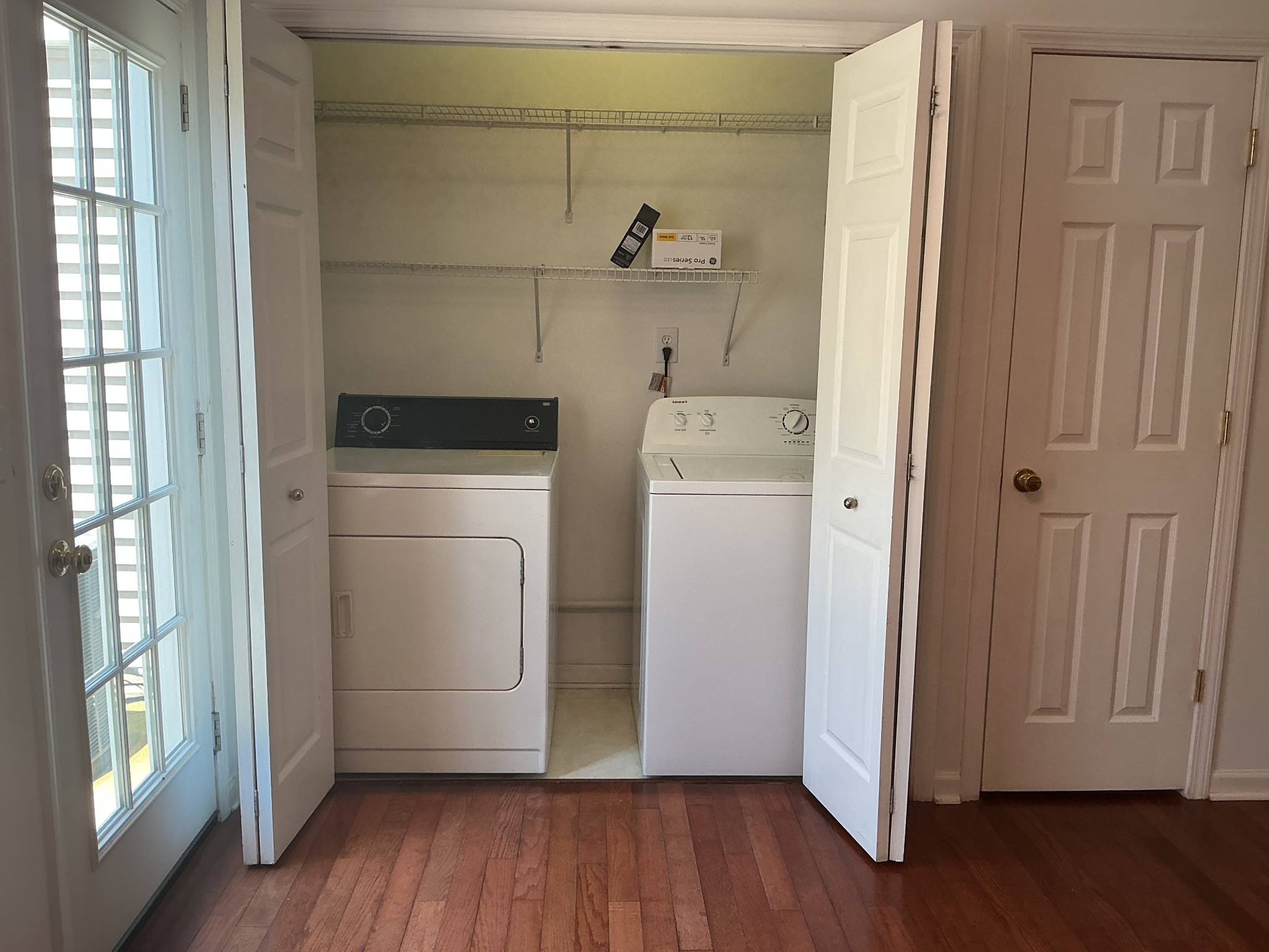 1101 Downs Boulevard, Unit J102 Franklin, TN 37064 - Photo 10 of 21 a view of washer and dryer with wooden floor