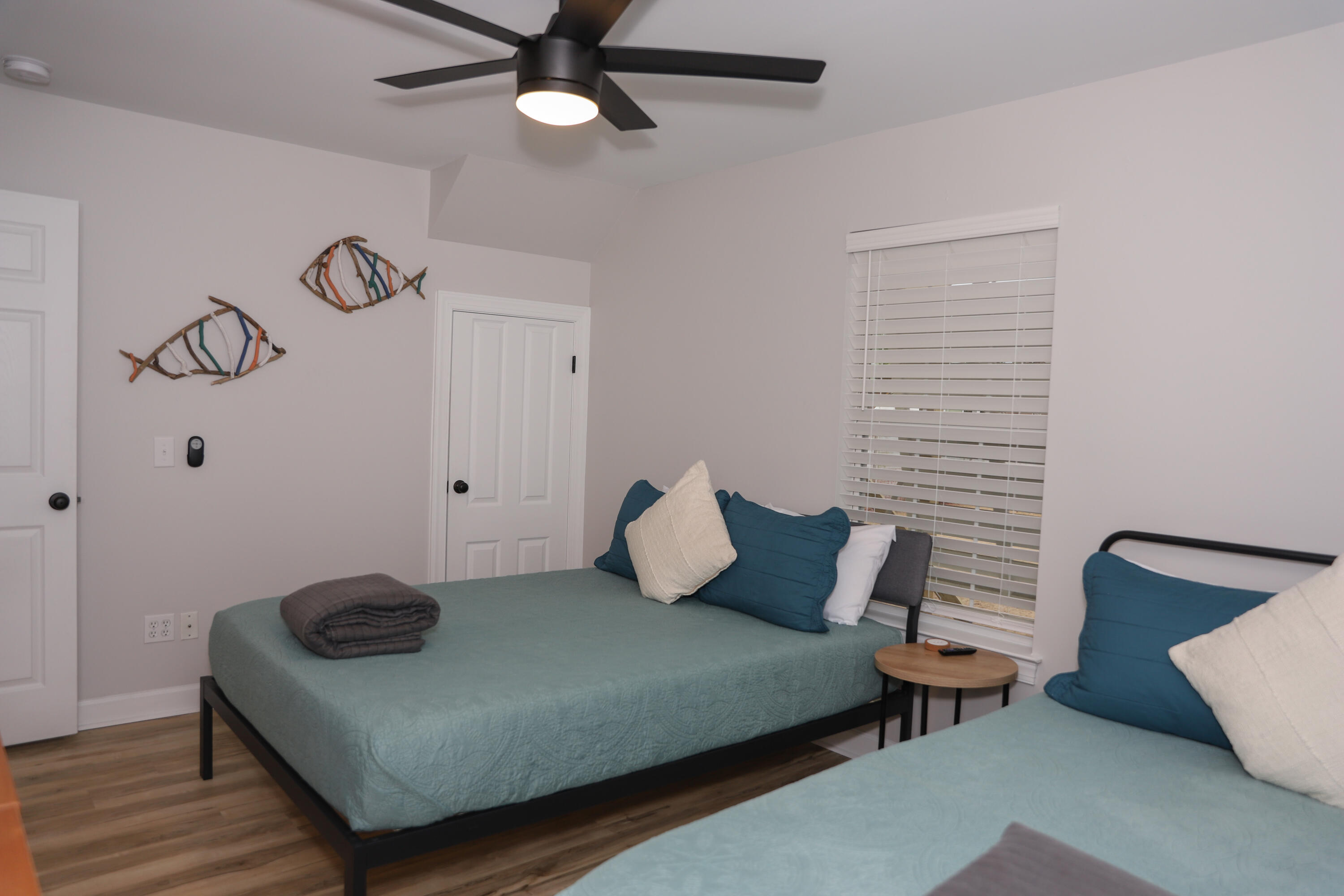 21924 Front Beach Road Panama City Beach, FL 32413 - Photo 102 of 120 a bedroom with a bed and a chandelier