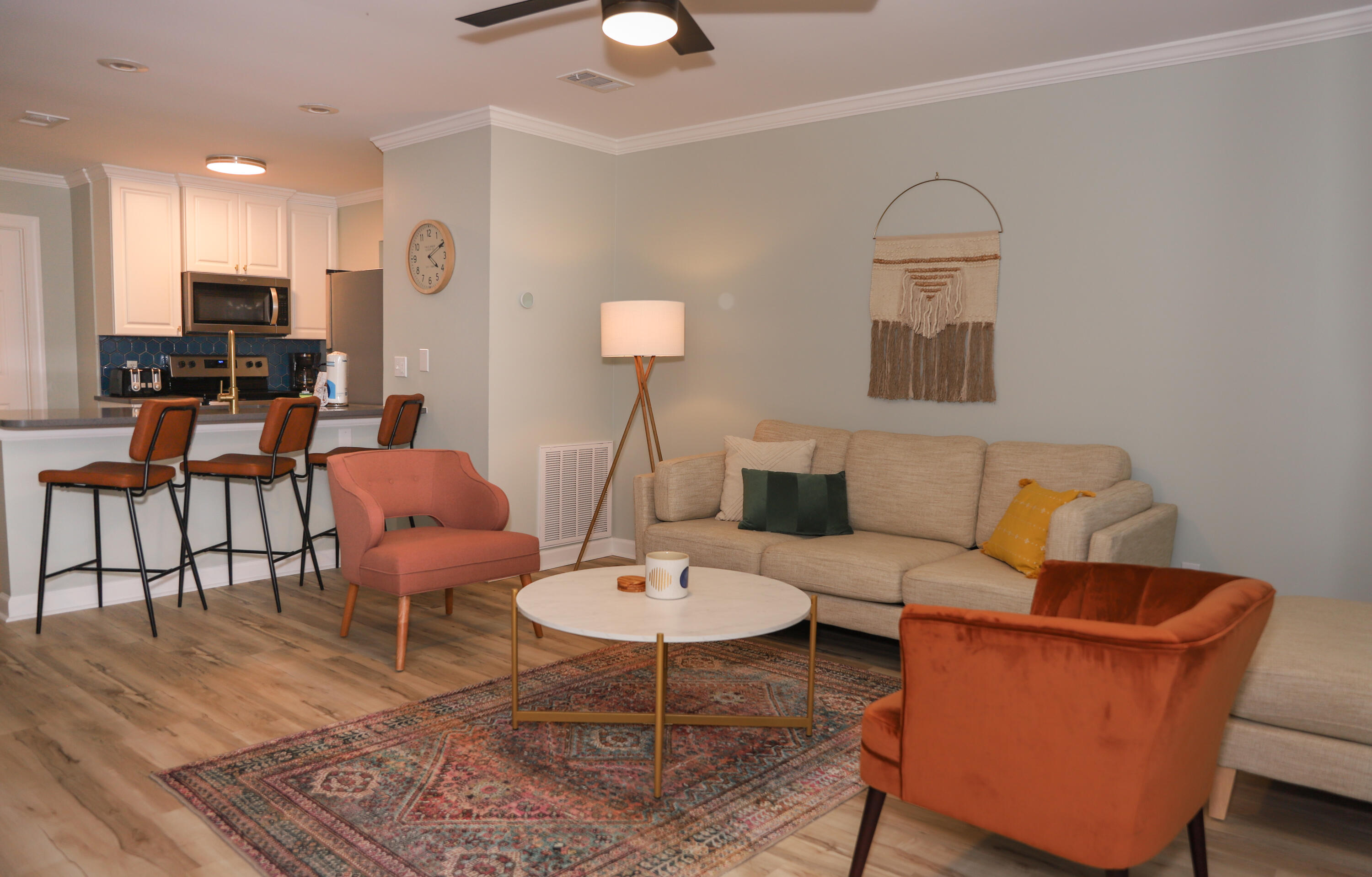 21924 Front Beach Road Panama City Beach, FL 32413 - Photo 106 of 120 a living room with furniture a rug and a chandelier