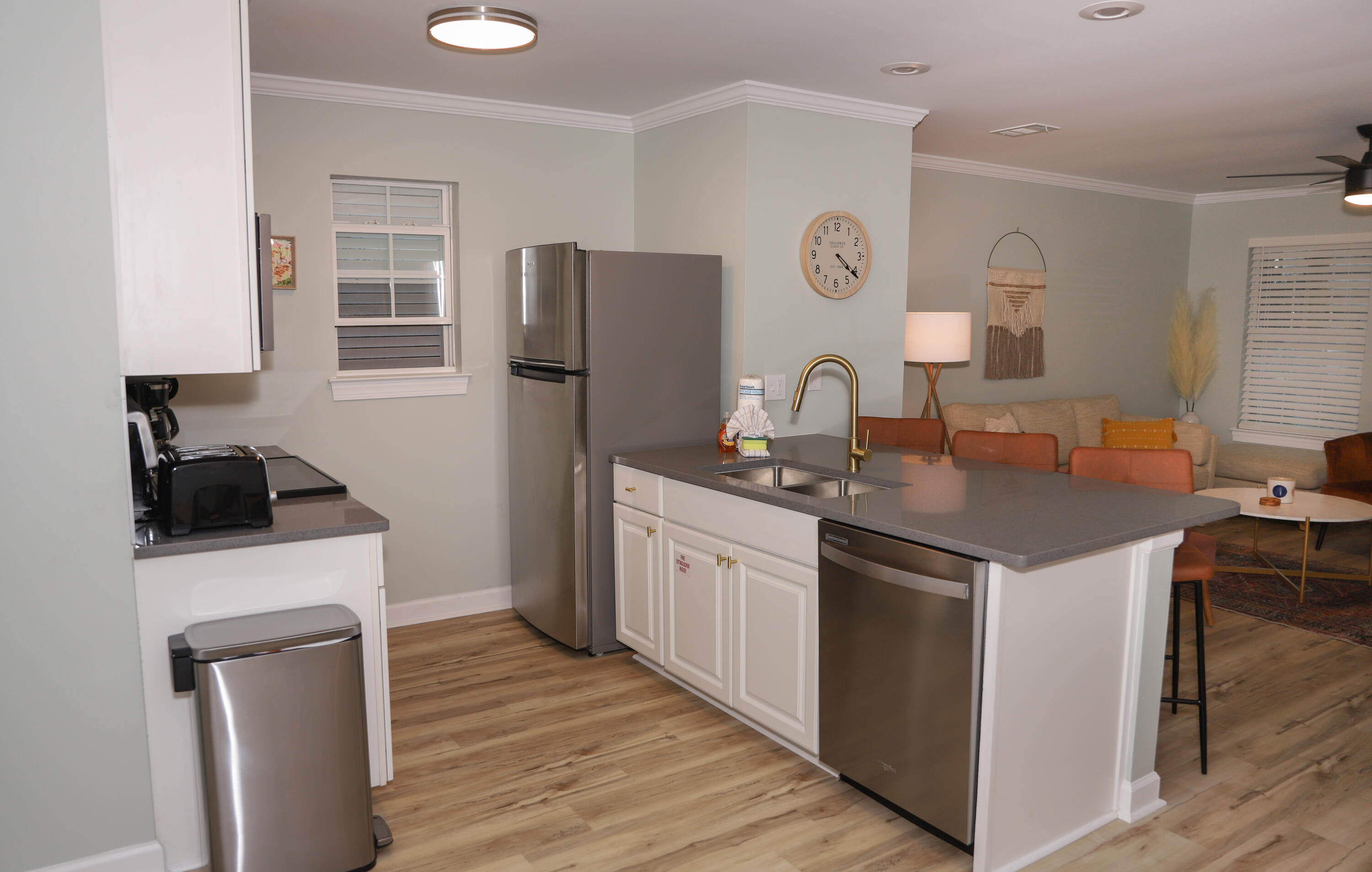 21924 Front Beach Road Panama City Beach, FL 32413 - Photo 109 of 120 a kitchen with stainless steel appliances granite countertop a sink stove and refrigerator