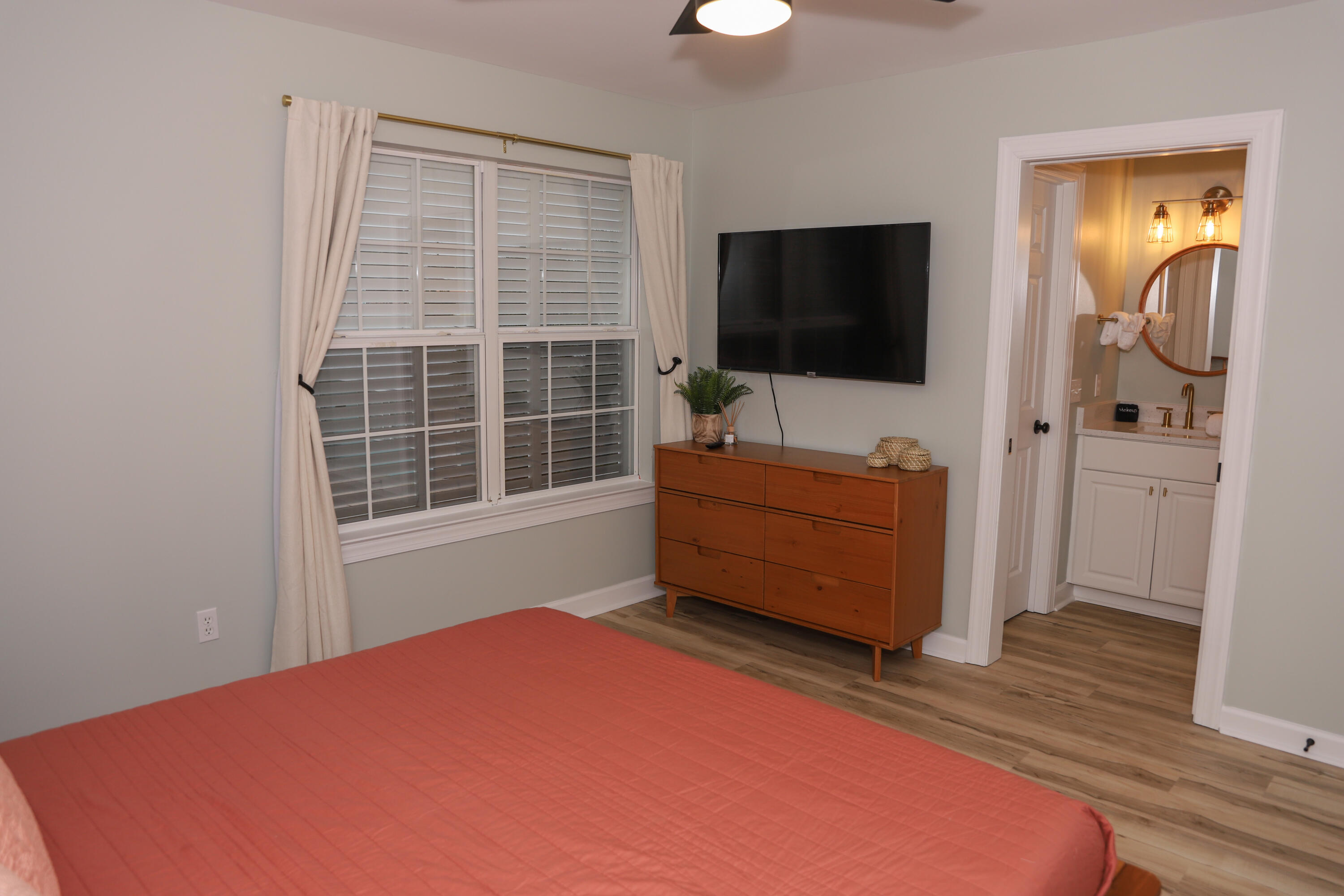 21924 Front Beach Road Panama City Beach, FL 32413 - Photo 113 of 120 a bedroom with furniture and flat screen tv