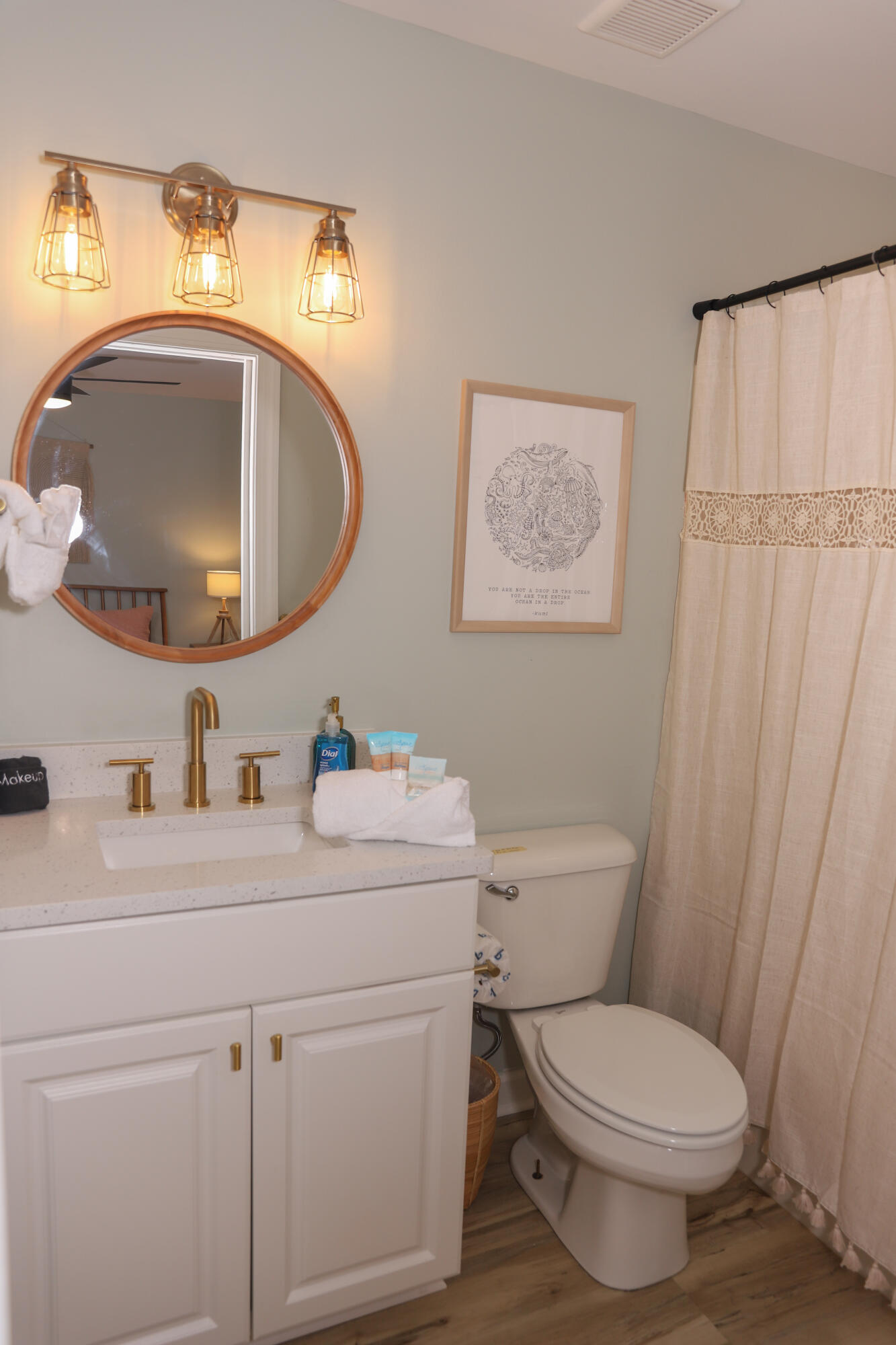 21924 Front Beach Road Panama City Beach, FL 32413 - Photo 117 of 120 a bathroom with a toilet a sink and a mirror