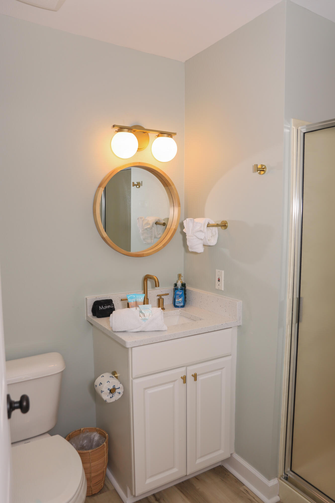 21924 Front Beach Road Panama City Beach, FL 32413 - Photo 119 of 120 a bathroom with a toilet sink vanity and mirror