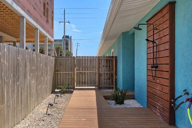a large kitchen with a table and a refrigerator
