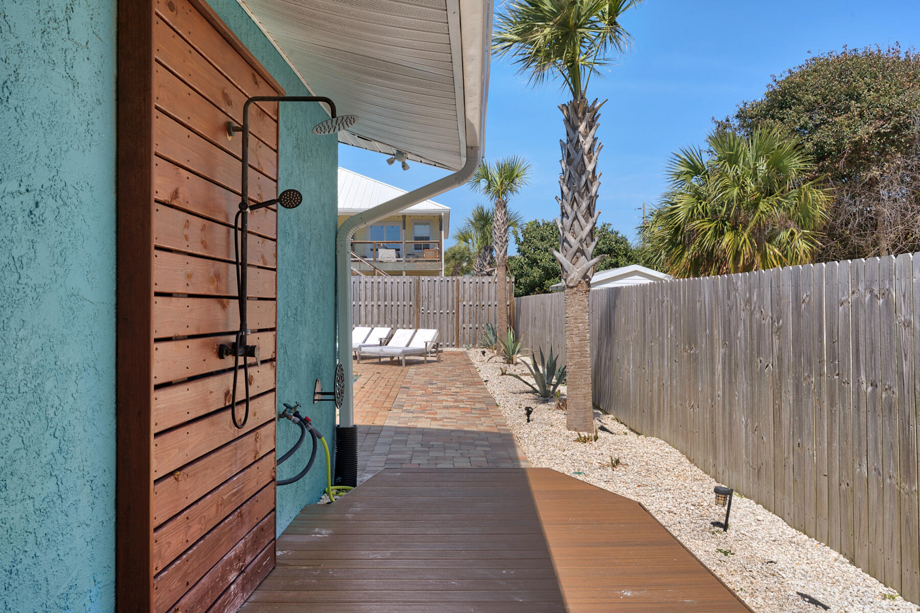 21924 Front Beach Road Panama City Beach, FL 32413 - Photo 17 of 120 a view of a pathway of a house with a yard
