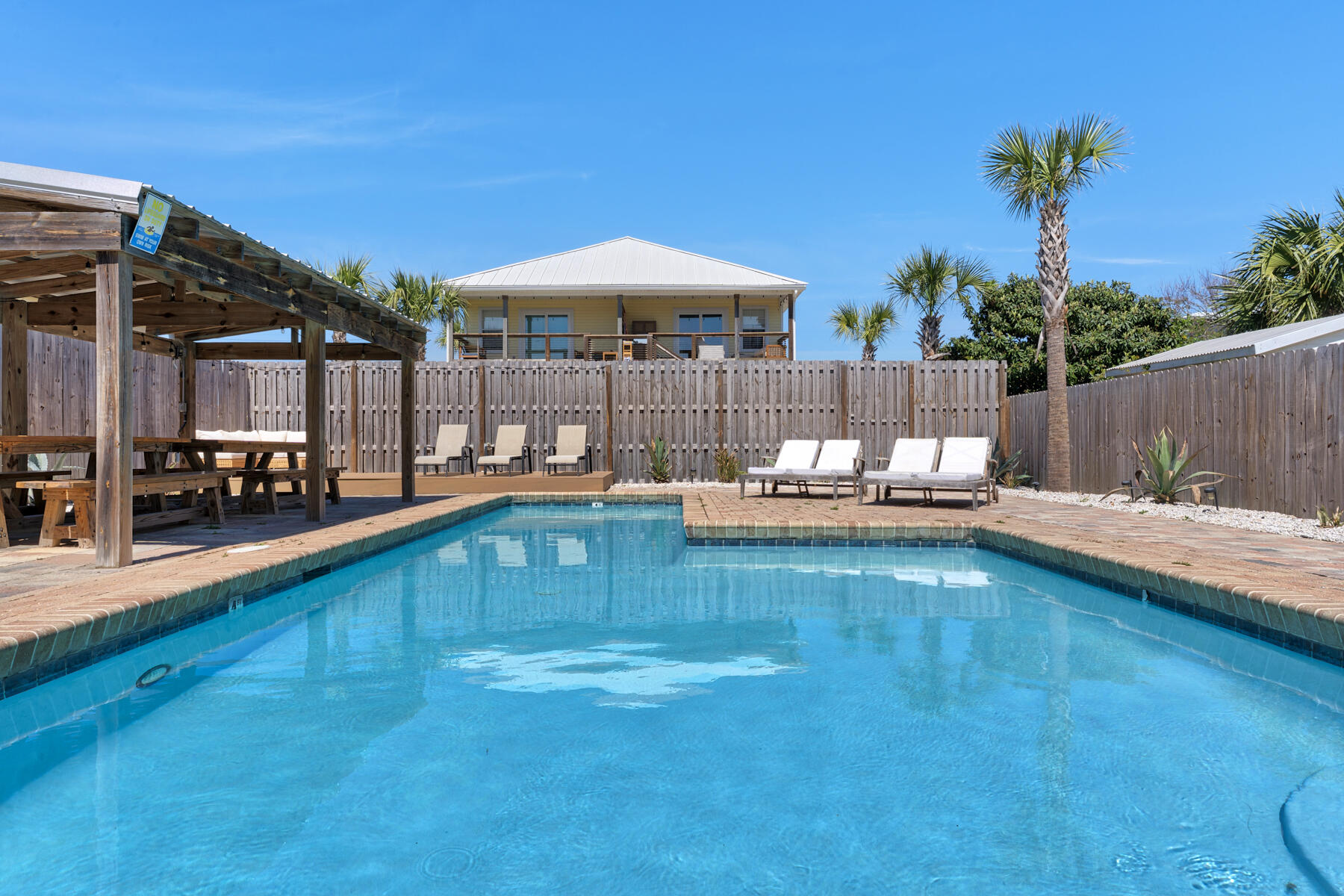 21924 Front Beach Road Panama City Beach, FL 32413 - Photo 28 of 120 a swimming pool view with a outdoor seating