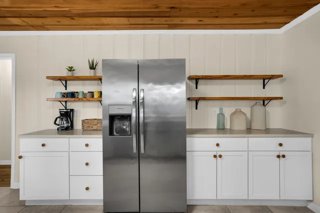 a bedroom with furniture and flat screen tv
