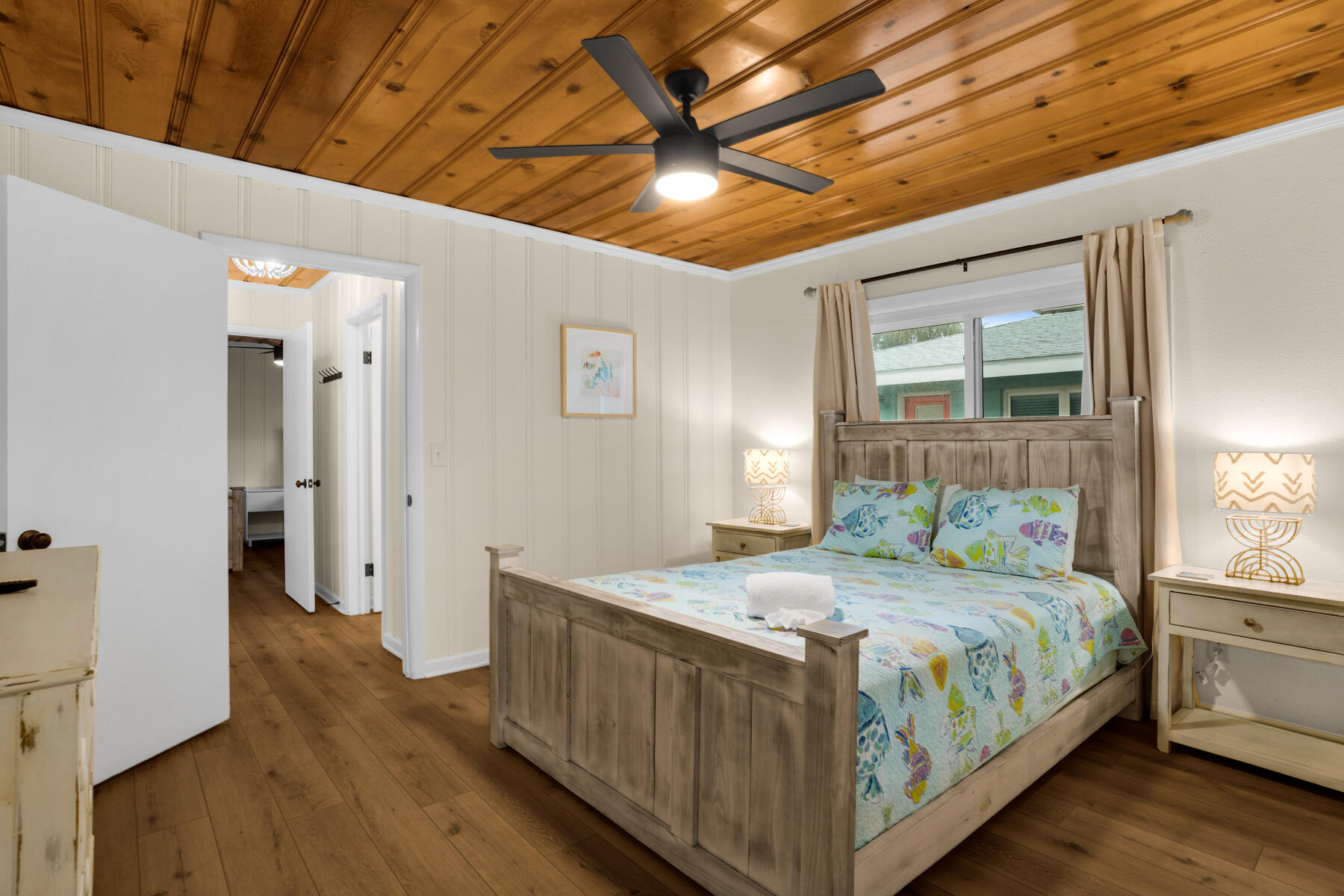 21924 Front Beach Road Panama City Beach, FL 32413 - Photo 51 of 120 a bedroom with a bed and a window