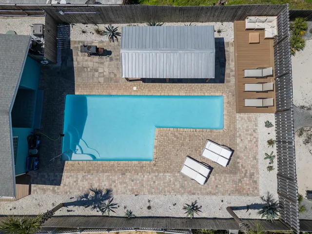 a view of a pathway of a house with a yard