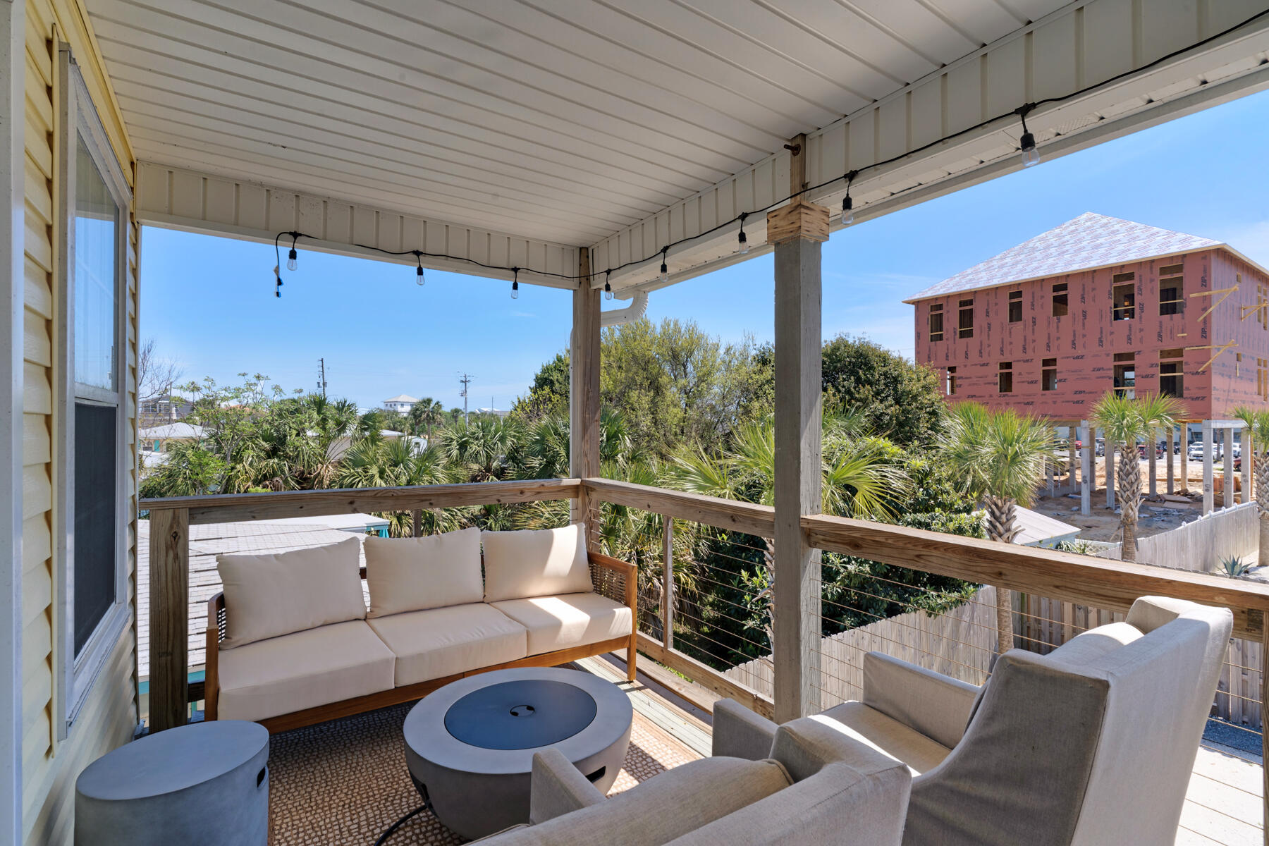 21924 Front Beach Road Panama City Beach, FL 32413 - Photo 73 of 120 a view of a patio with couches table and chairs and potted plants