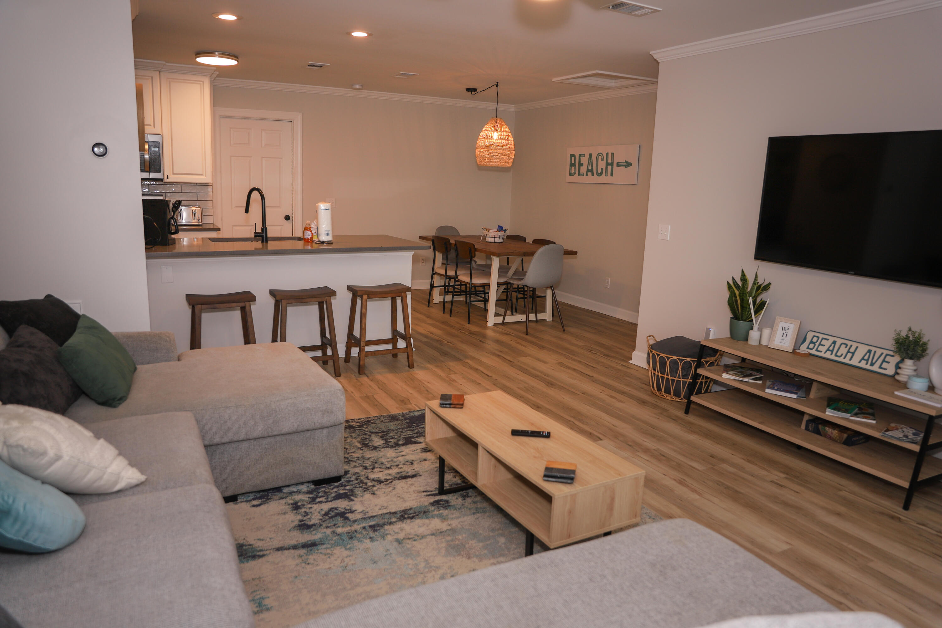 21924 Front Beach Road Panama City Beach, FL 32413 - Photo 87 of 120 a living room with furniture and a flat screen tv