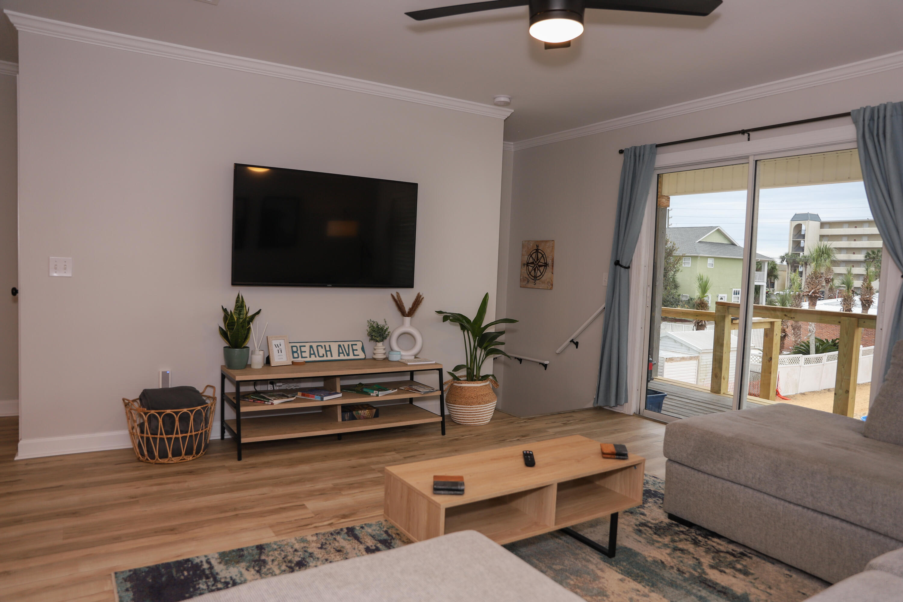 21924 Front Beach Road Panama City Beach, FL 32413 - Photo 90 of 120 a living room with furniture and a flat screen tv