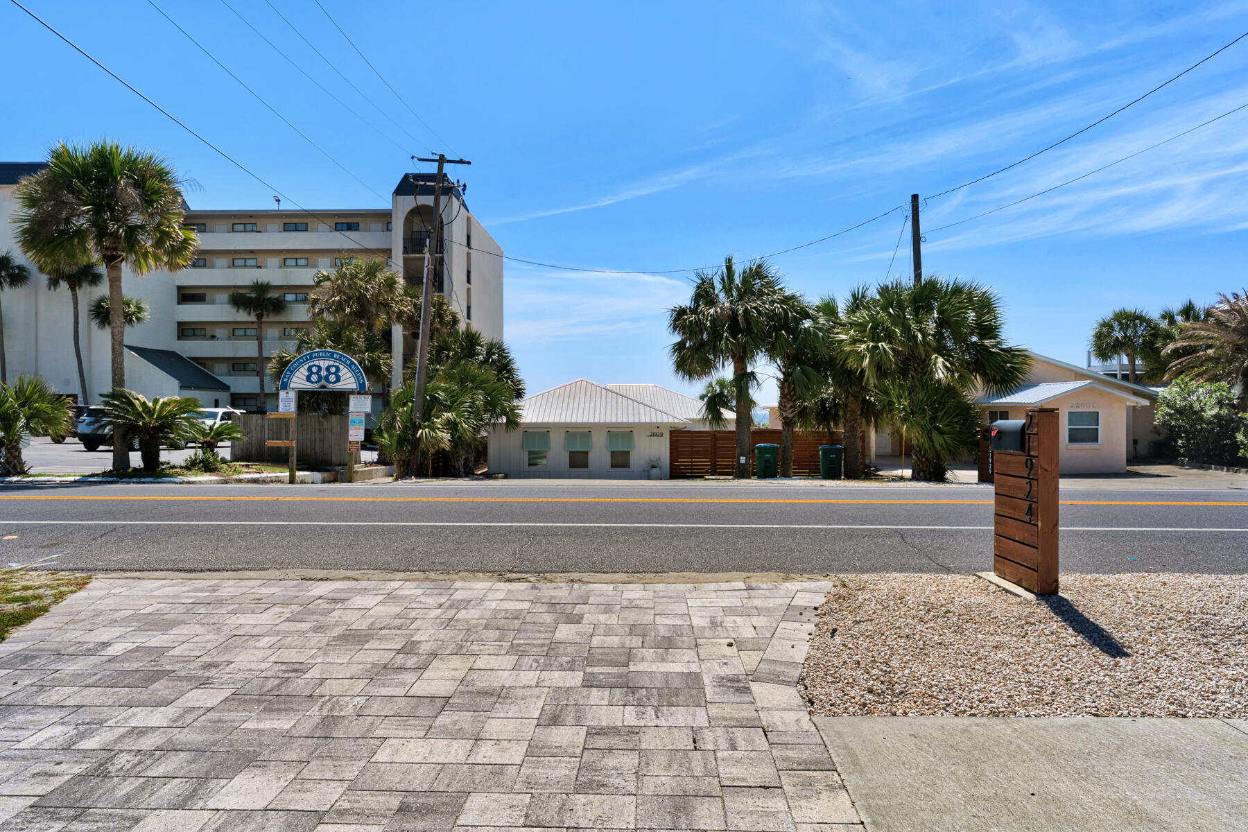 21924 Front Beach Road Panama City Beach, FL 32413 - Photo 9 of 120 a front view of a house with a yard
