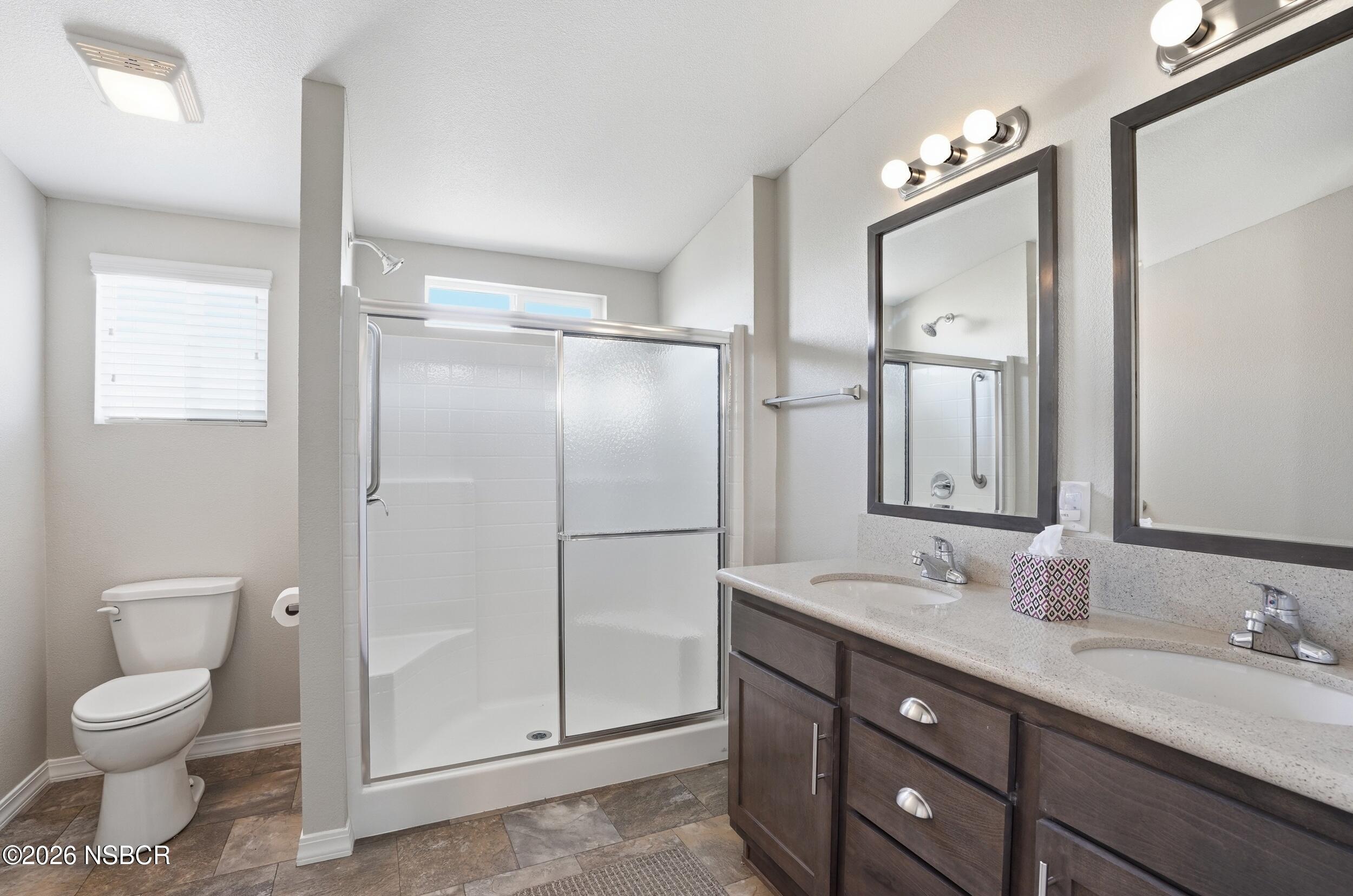 500 Atascadero Road, Unit M3 Morro Bay, CA 93442 - Photo 21 of 29 a bathroom with a granite countertop sink toilet and shower