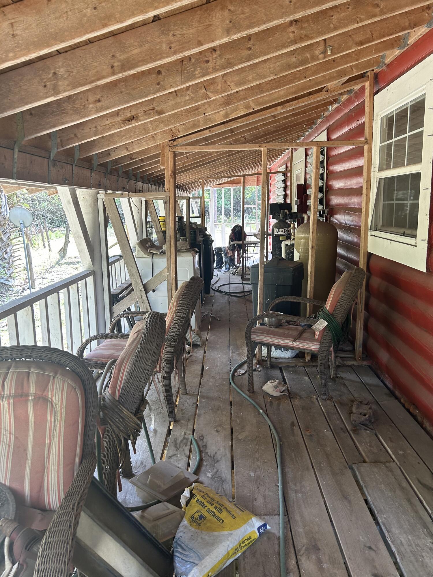 4810 Windmill Road Loxahatchee, FL 33470 - Photo 21 of 34 a view of a patio with table and chairs