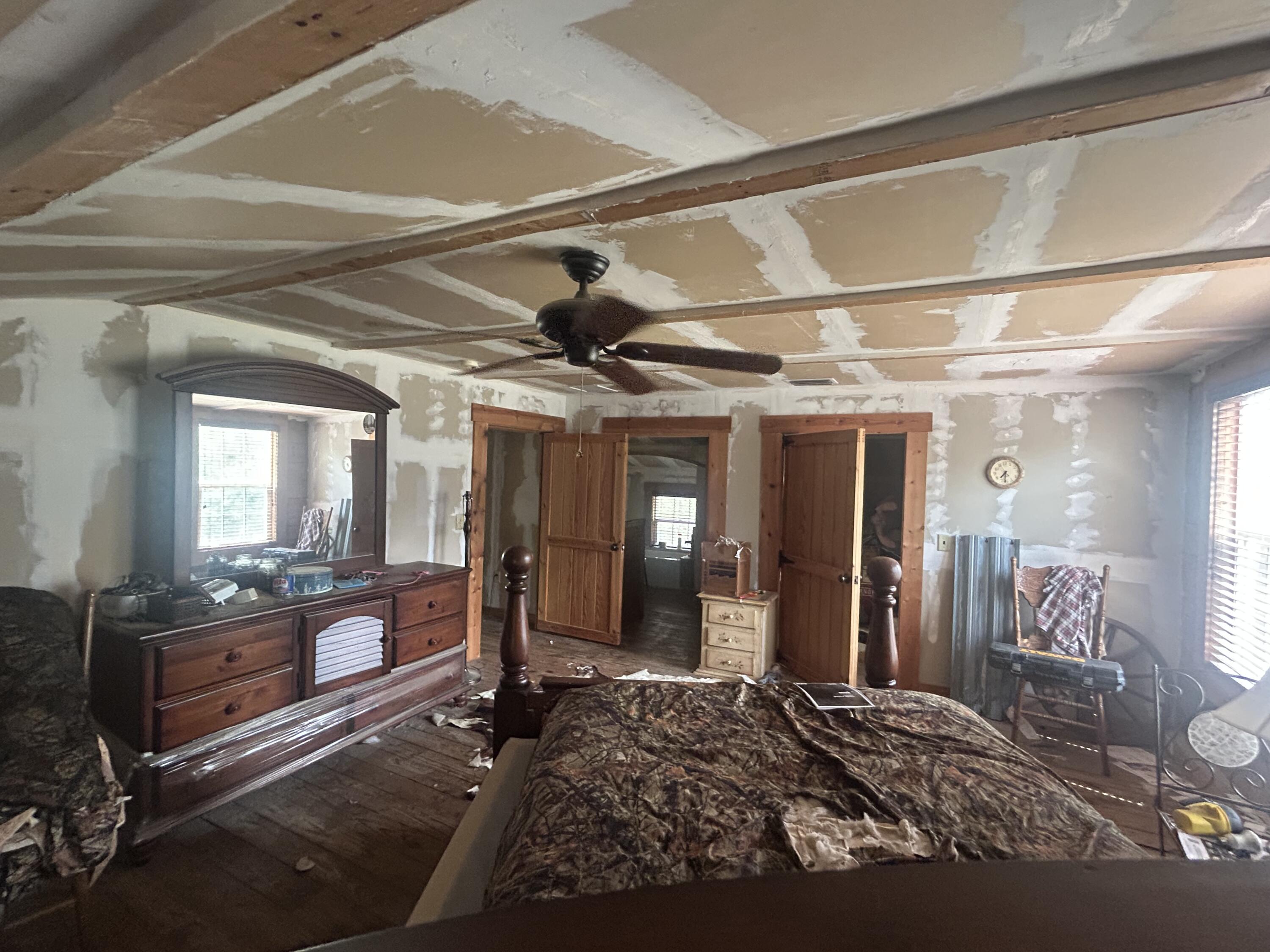 4810 Windmill Road Loxahatchee, FL 33470 - Photo 23 of 34 a bedroom with a bed next to a window