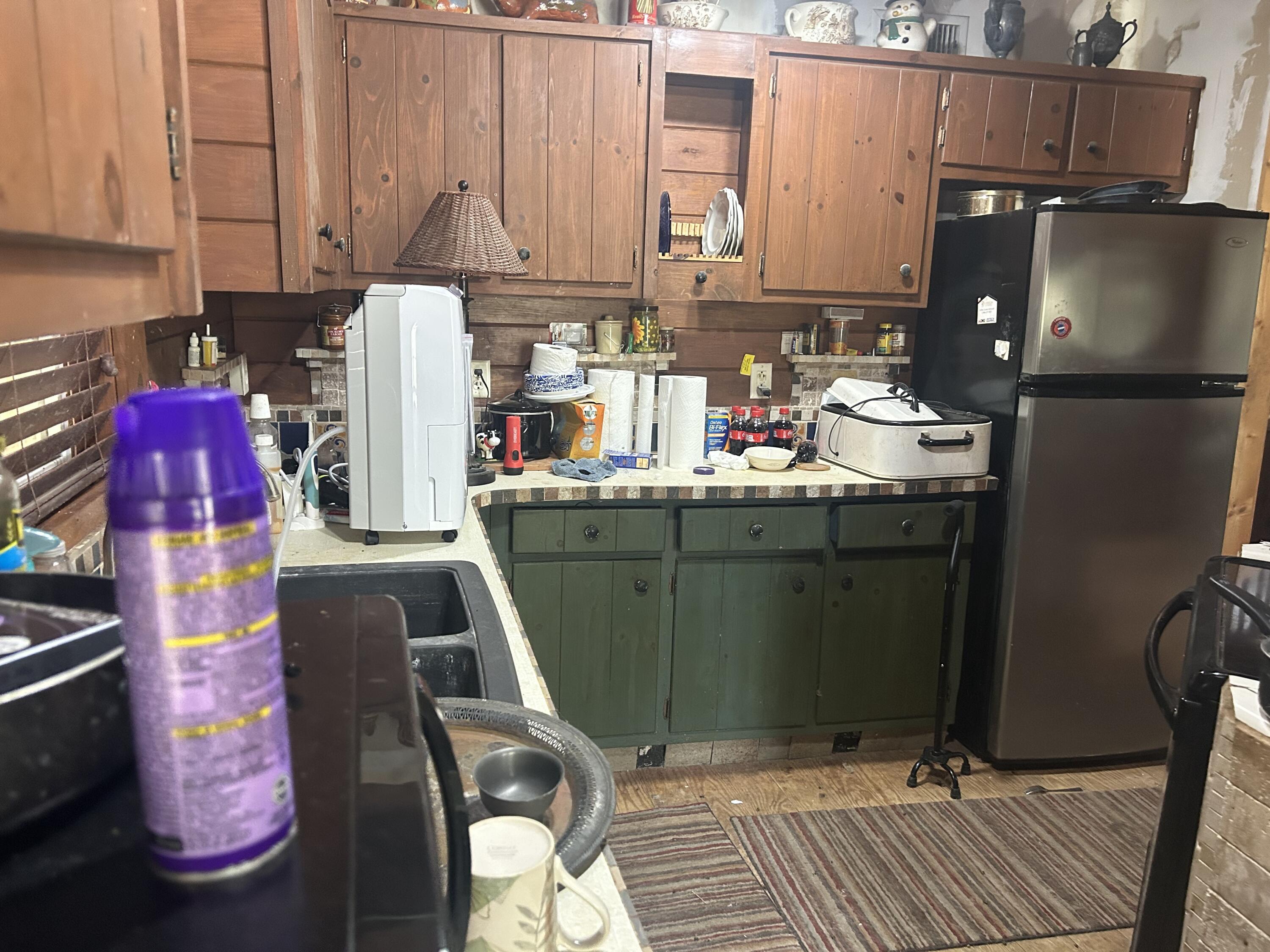 4810 Windmill Road Loxahatchee, FL 33470 - Photo 30 of 34 a kitchen with a refrigerator and a sink