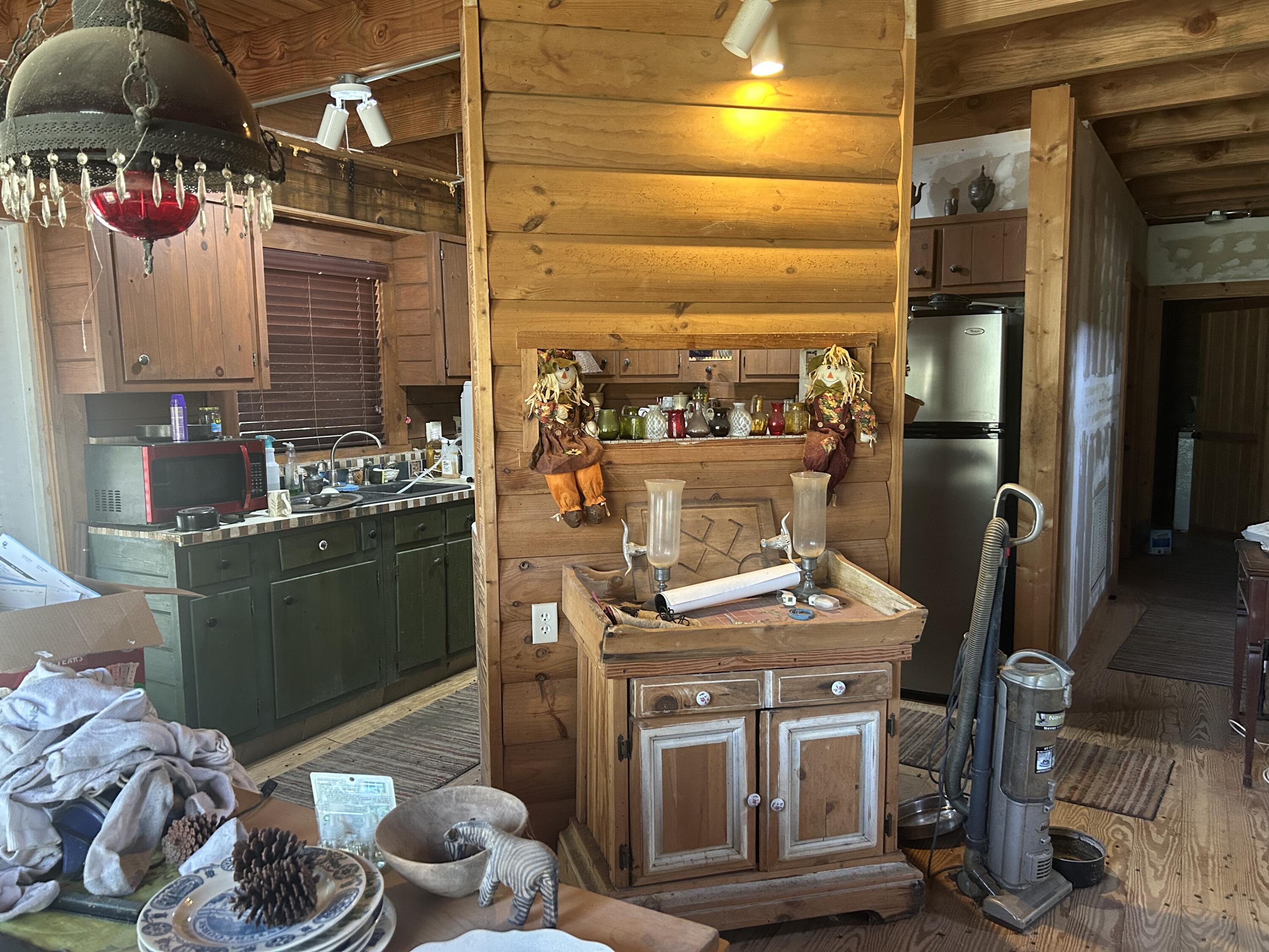 4810 Windmill Road Loxahatchee, FL 33470 - Photo 32 of 34 a kitchen with a stove and a refrigerator