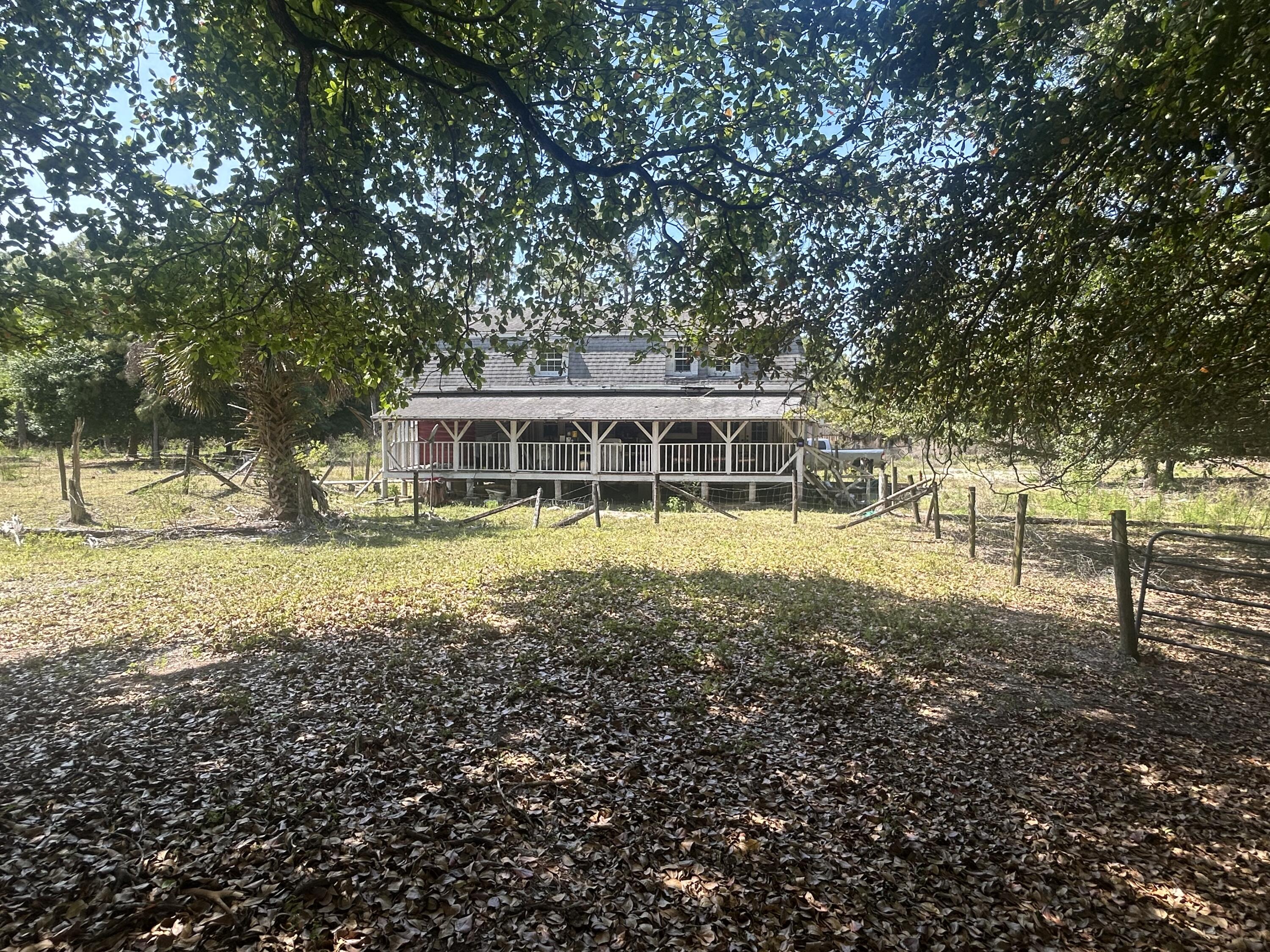 4810 Windmill Road Loxahatchee, FL 33470 - Photo 7 of 34 a view of a house with yard and sitting area