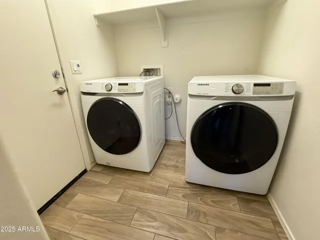 a utility room with dryer and washer