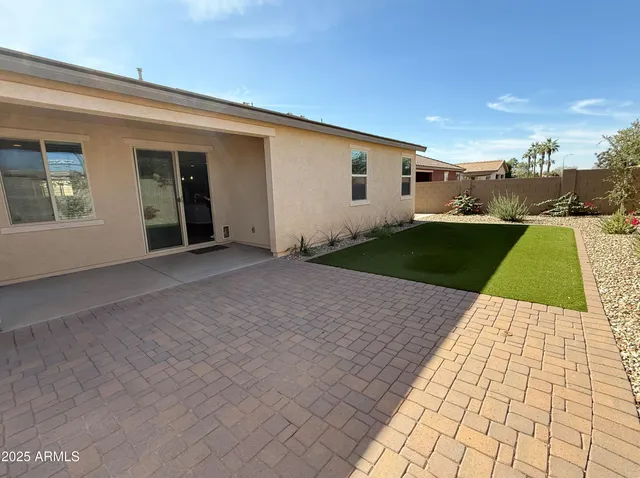 a view of a backyard of the house