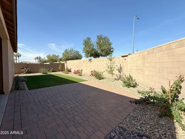 a view of a backyard of the house