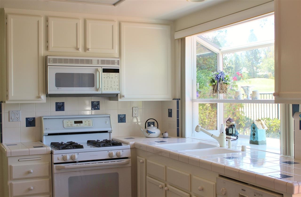 14572 Rutledge Square San Diego, CA 92128 - Photo 14 of 25 Kitchen Bay window looks out onto rear yard and Golf Course View.