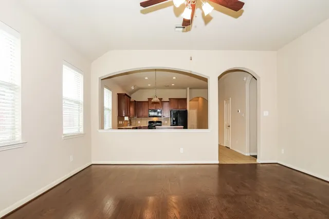 a kitchen with stainless steel appliances granite countertop a stove a sink dishwasher and a refrigerator