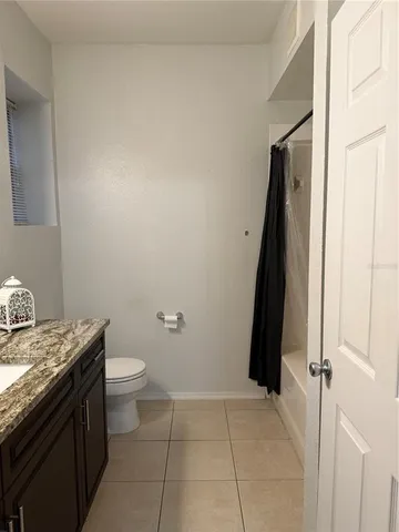 a bathroom with a sink a toilet and a tub