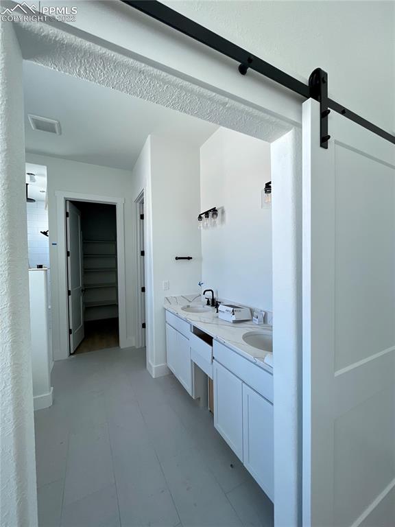 8350 Howdy Partner View Peyton, CO 80831 - Photo 8 of 14 a bathroom with a double vanity sink toilet and shower