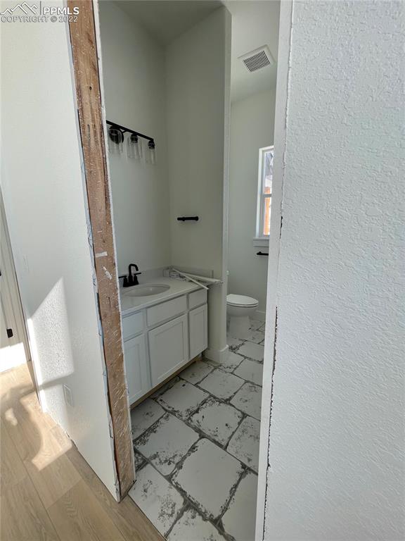 8350 Howdy Partner View Peyton, CO 80831 - Photo 10 of 14 a bathroom with a sink toilet and shower
