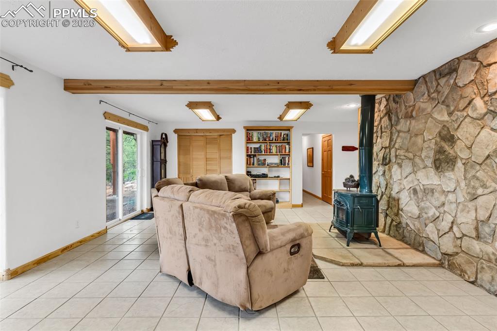 209 Rosewood Road Westcliffe, CO 81252 - Photo 32 of 49 Cozy fireplace and large laundry closet with laundry sink