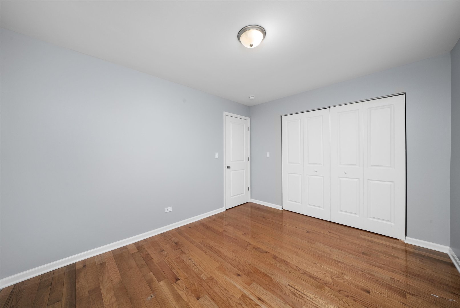 327 Wisconsin Avenue, Unit 5B Oak Park, IL 60302 - Photo 11 of 18 a view of an empty room with wooden floor