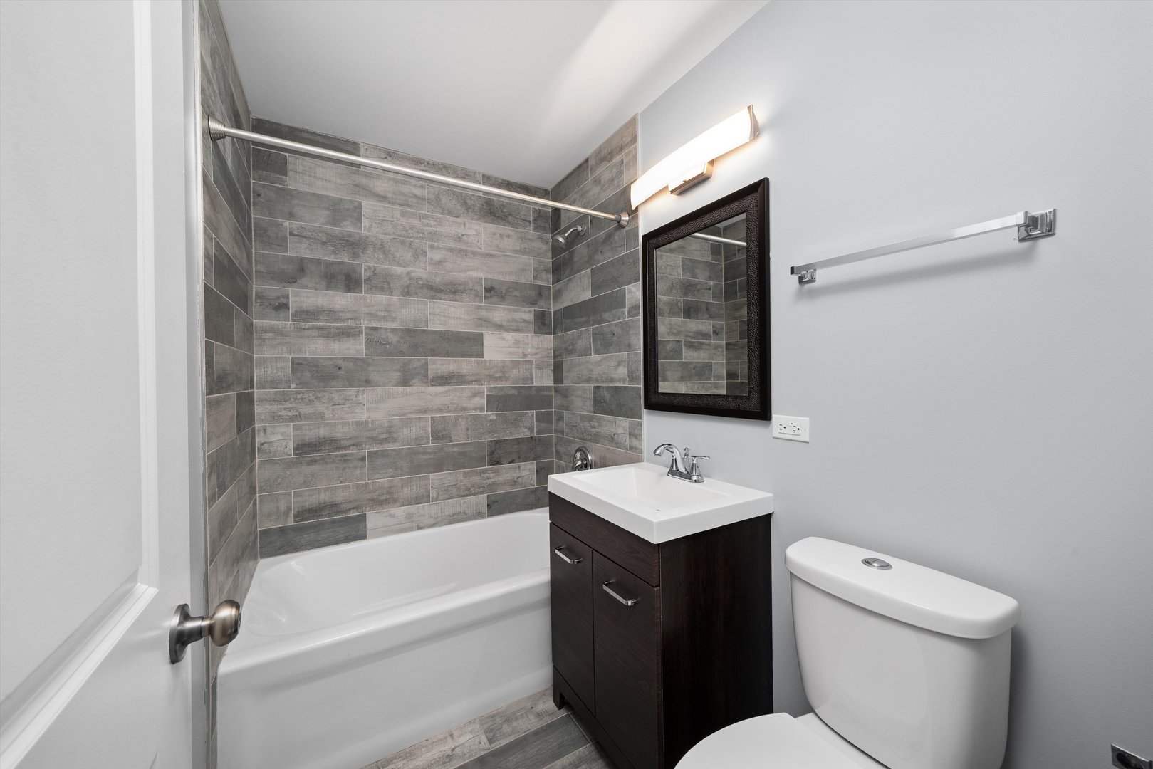 327 Wisconsin Avenue, Unit 5B Oak Park, IL 60302 - Photo 9 of 18 a bathroom with a sink and a mirror