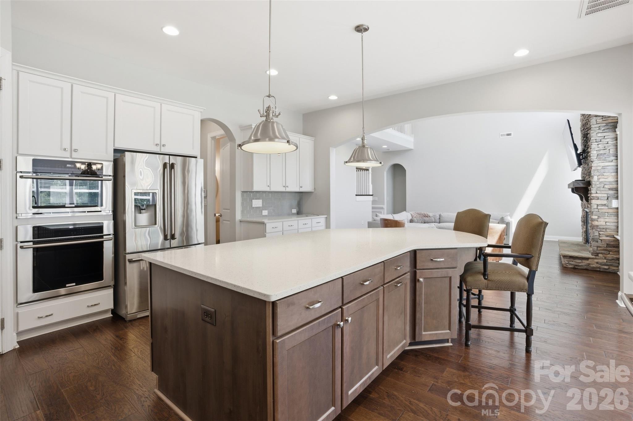 14022 Salem Ridge Road Huntersville, NC 28078 - Photo 11 of 38 a kitchen with a table chairs refrigerator and microwave